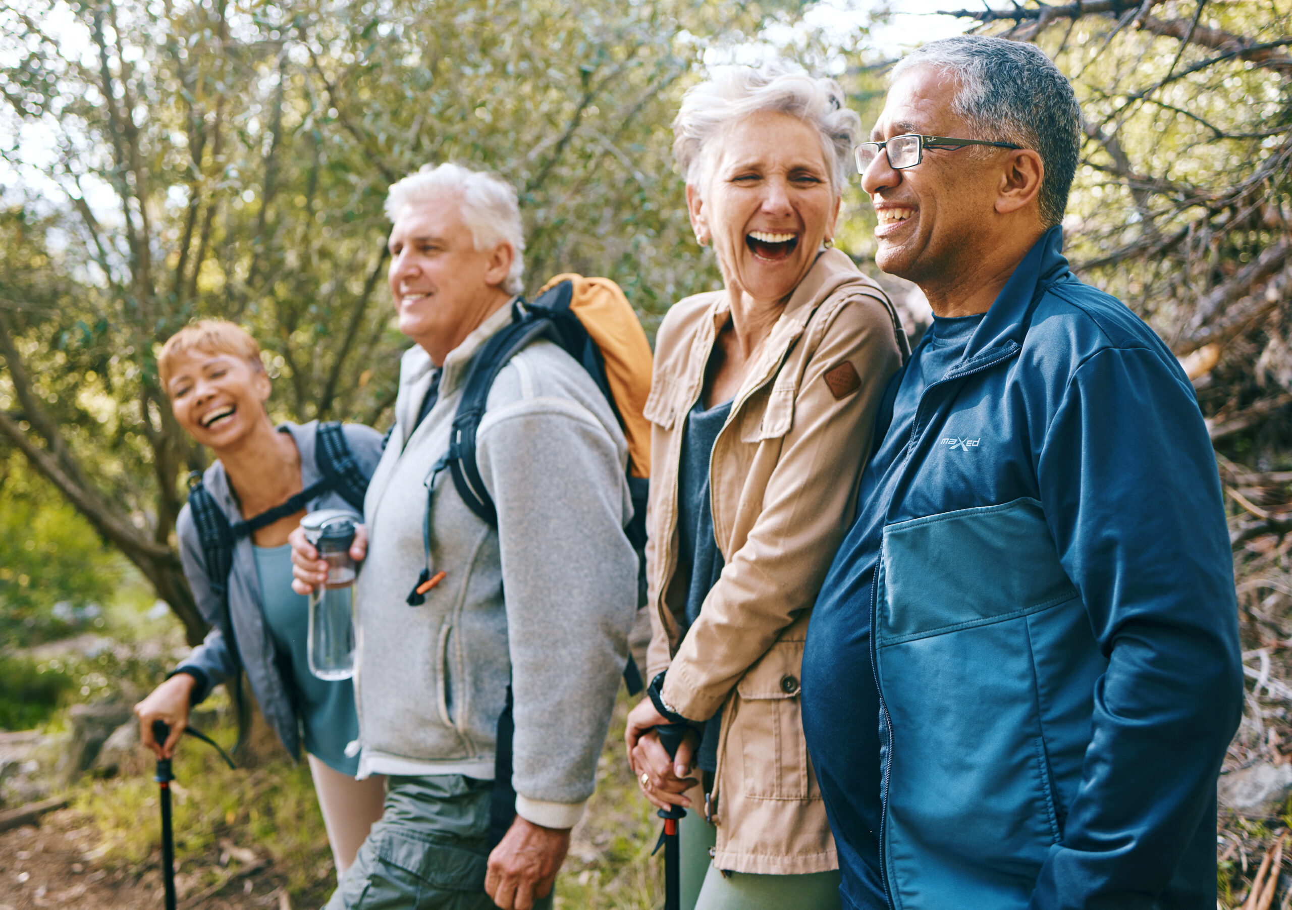 people smiling and hiking in nature